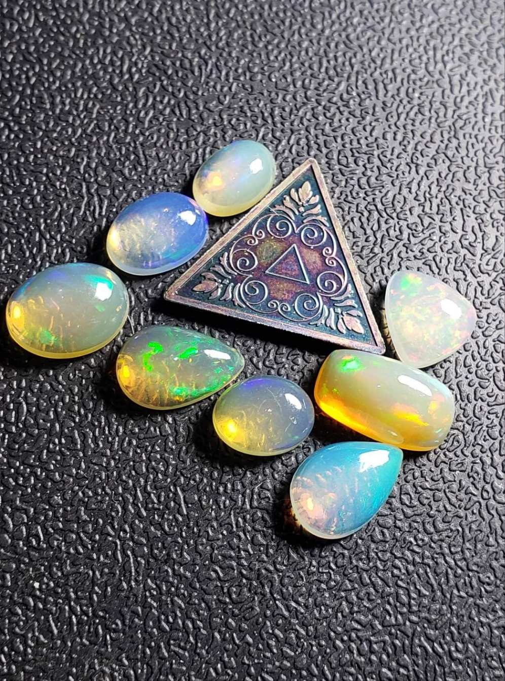 Lot of small assorted Ethiopian Welo Opal Cabochons. Oval,tear drop,trillion. 6mm -11mm. 10 carats. Accents. Jewelry making supplies. Ring sized.