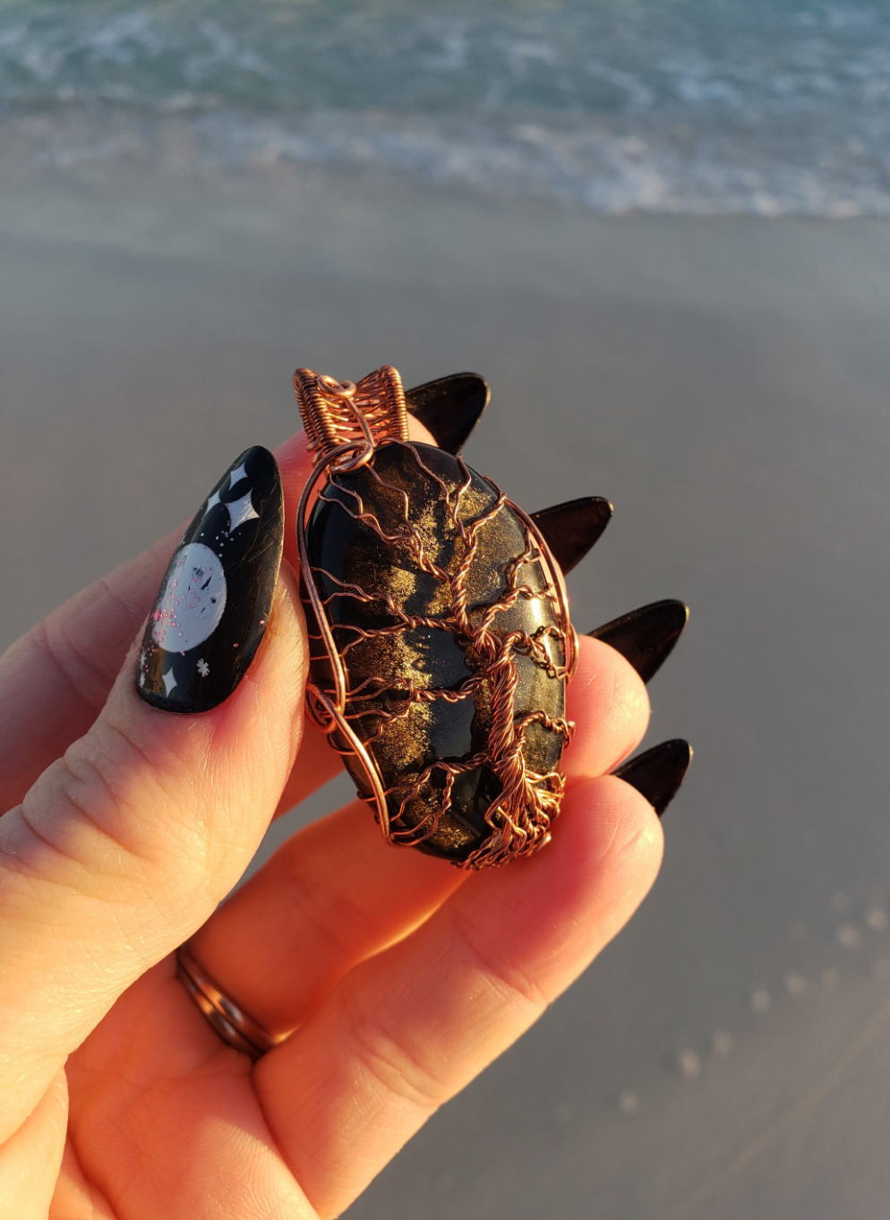 Lovely Tree of Life wire wrapped pendant. Gold Sheen Obsidian Comes On leather cord. Handmade. Wire wraps. Copper wire