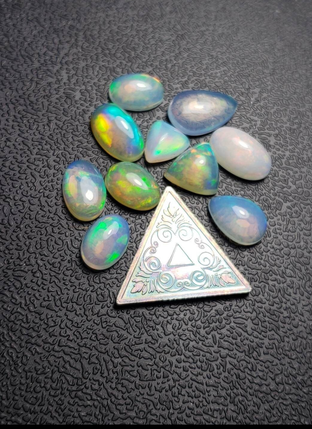 Lot of small assorted Ethiopian Welo Opal Cabochons. Oval,tear drop,trillion. 6mm -11mm. 10 carats. Accents. Jewelry making supplies. Ring sized.
