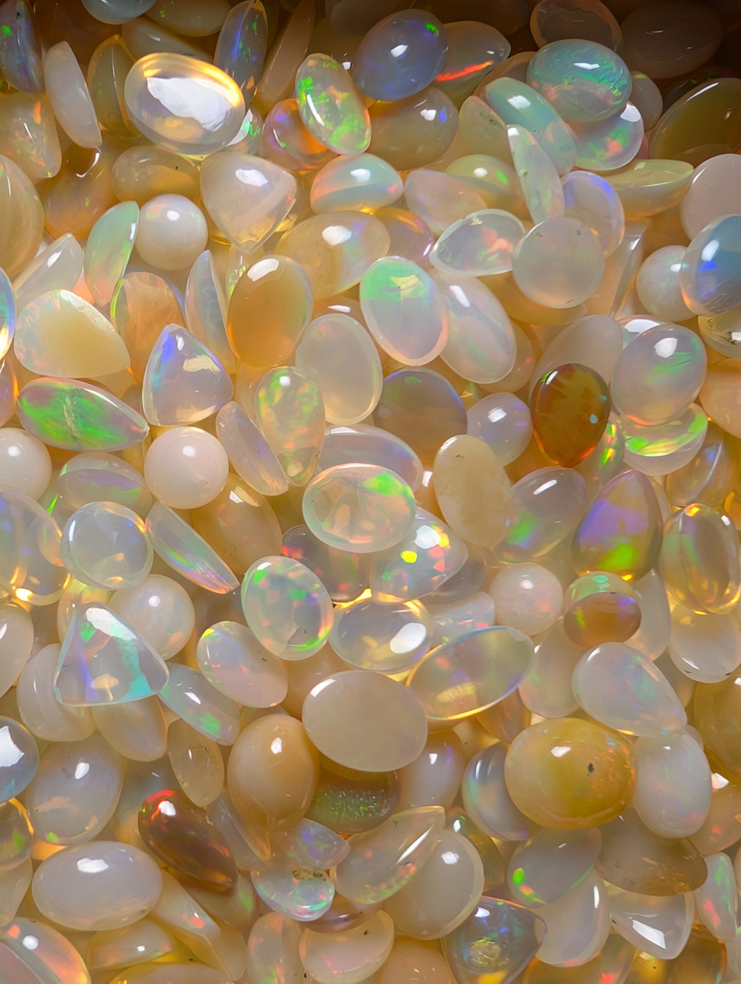 Lot of small assorted Ethiopian Welo Opal Cabochons. Oval,tear drop,trillion. 6mm -11mm. 10 carats. Accents. Jewelry making supplies. Ring sized.