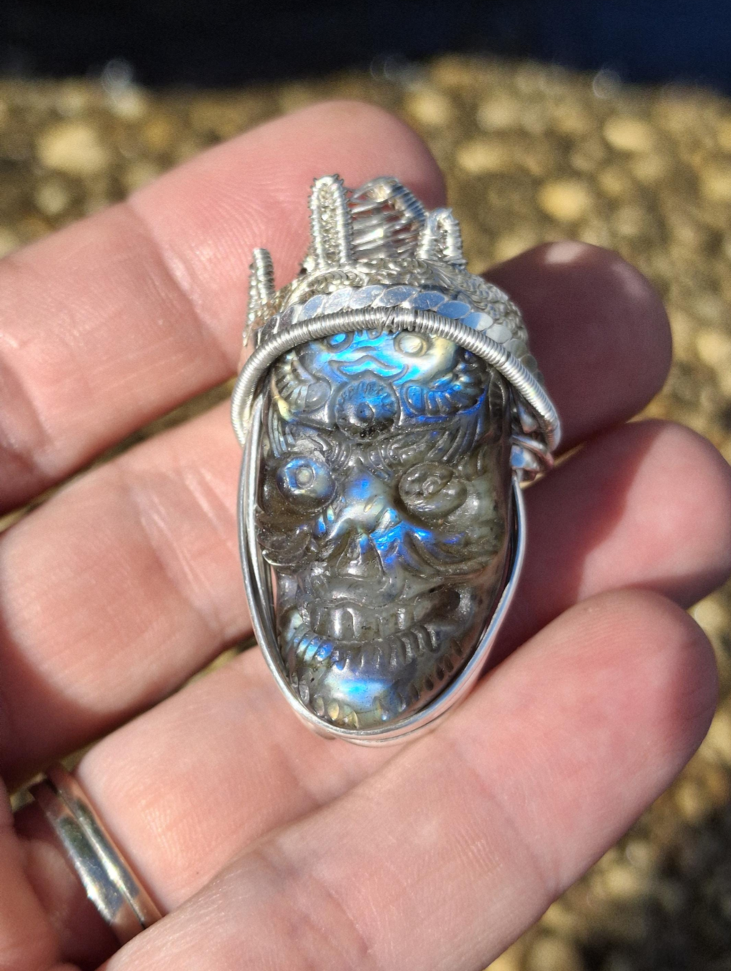 Stunning Wire wrapped pendant. Sterling silver Wire wrapped around a labradorite carved skull cabochon. Pendants. Heady. Gifts.