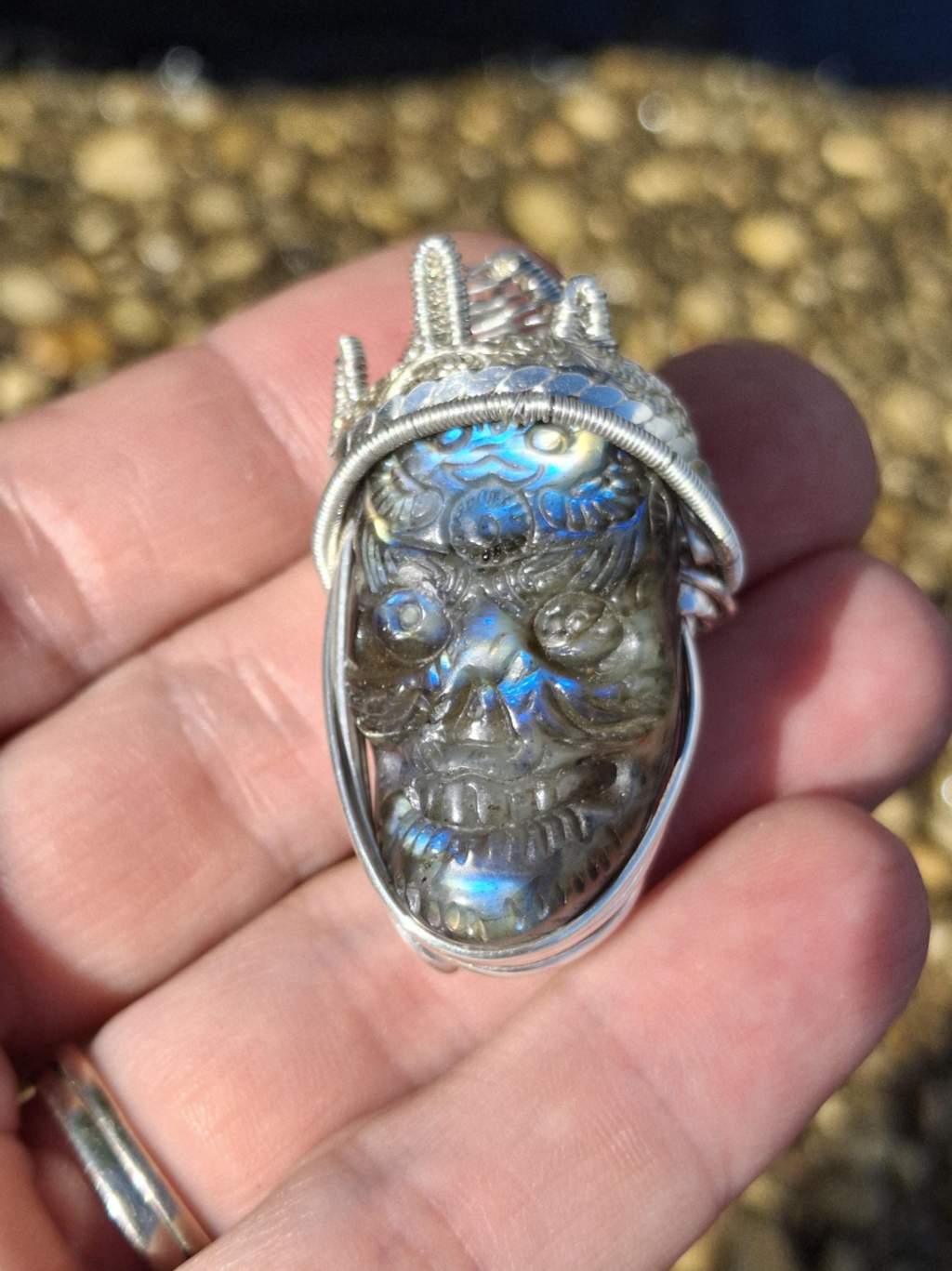 Stunning Wire wrapped pendant. Sterling silver Wire wrapped around a labradorite carved skull cabochon. Pendants. Heady. Gifts.