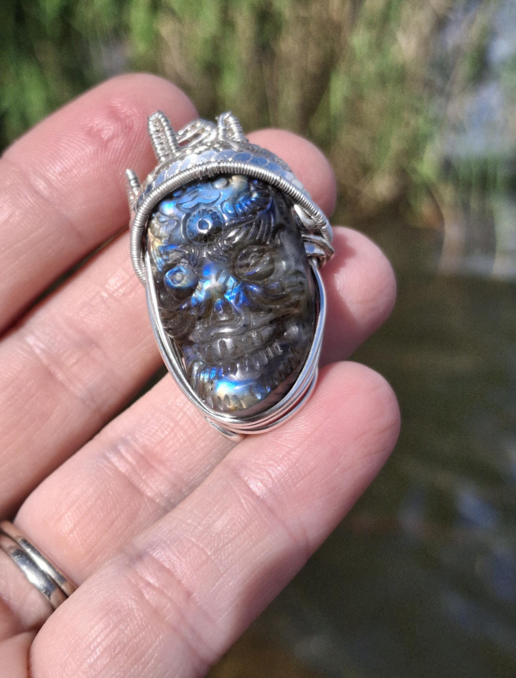 Stunning Wire wrapped pendant. Sterling silver Wire wrapped around a labradorite carved skull cabochon. Pendants. Heady. Gifts.