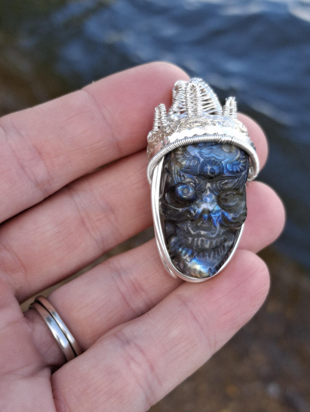 Stunning Wire wrapped pendant. Sterling silver Wire wrapped around a labradorite carved skull cabochon. Pendants. Heady. Gifts.