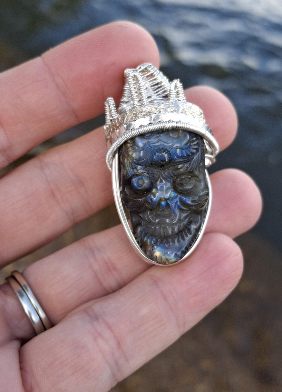 Stunning Wire wrapped pendant. Sterling silver Wire wrapped around a labradorite carved skull cabochon. Pendants. Heady. Gifts.