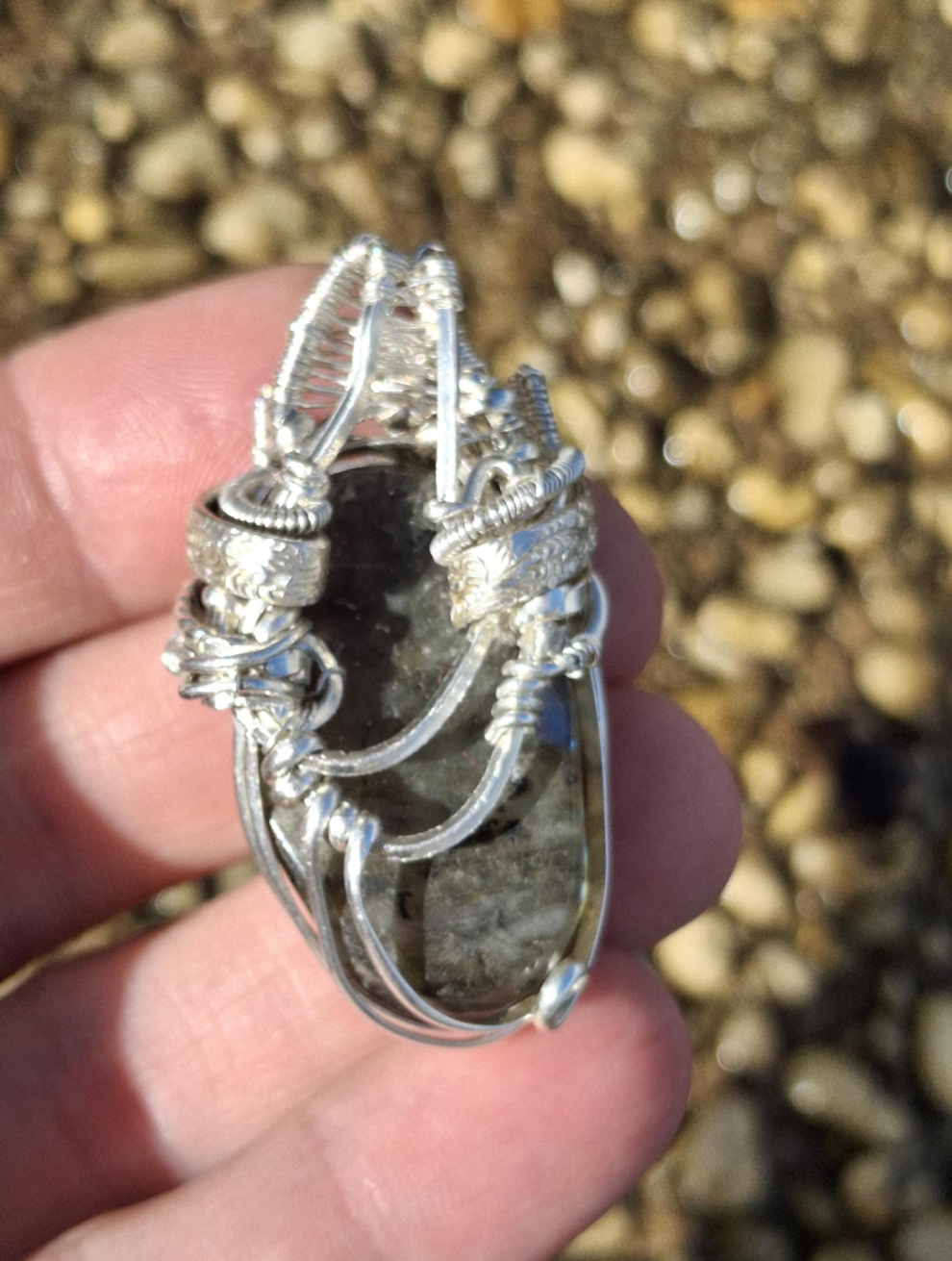 Stunning Wire wrapped pendant. Sterling silver Wire wrapped around a labradorite carved skull cabochon. Pendants. Heady. Gifts.