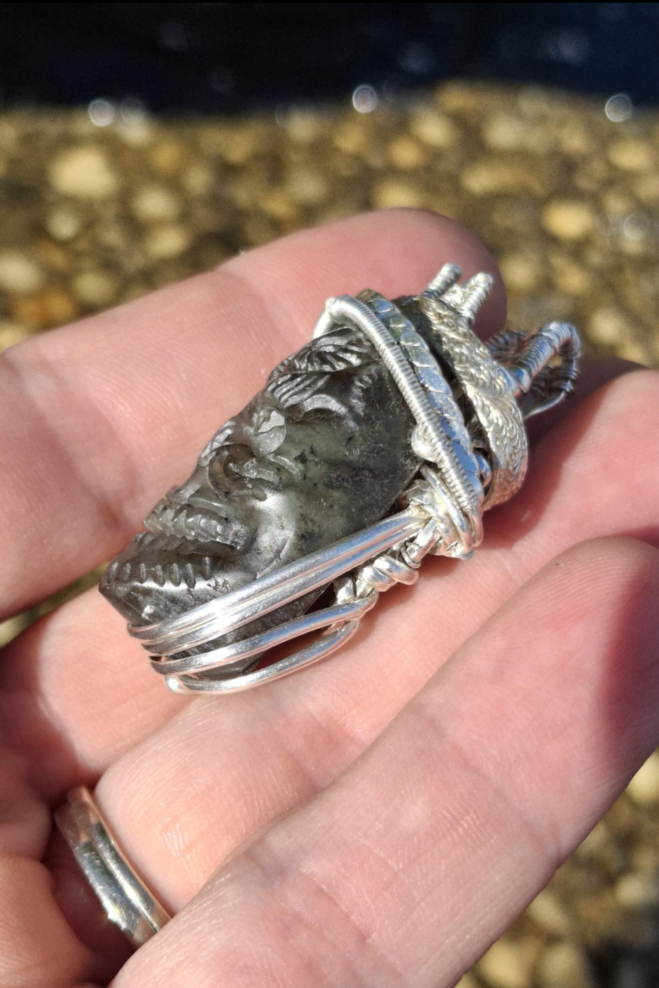 Stunning Wire wrapped pendant. Sterling silver Wire wrapped around a labradorite carved skull cabochon. Pendants. Heady. Gifts.
