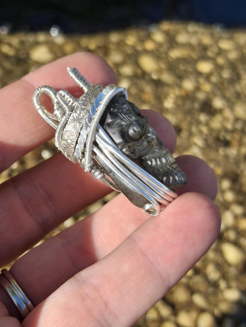 Stunning Wire wrapped pendant. Sterling silver Wire wrapped around a labradorite carved skull cabochon. Pendants. Heady. Gifts.