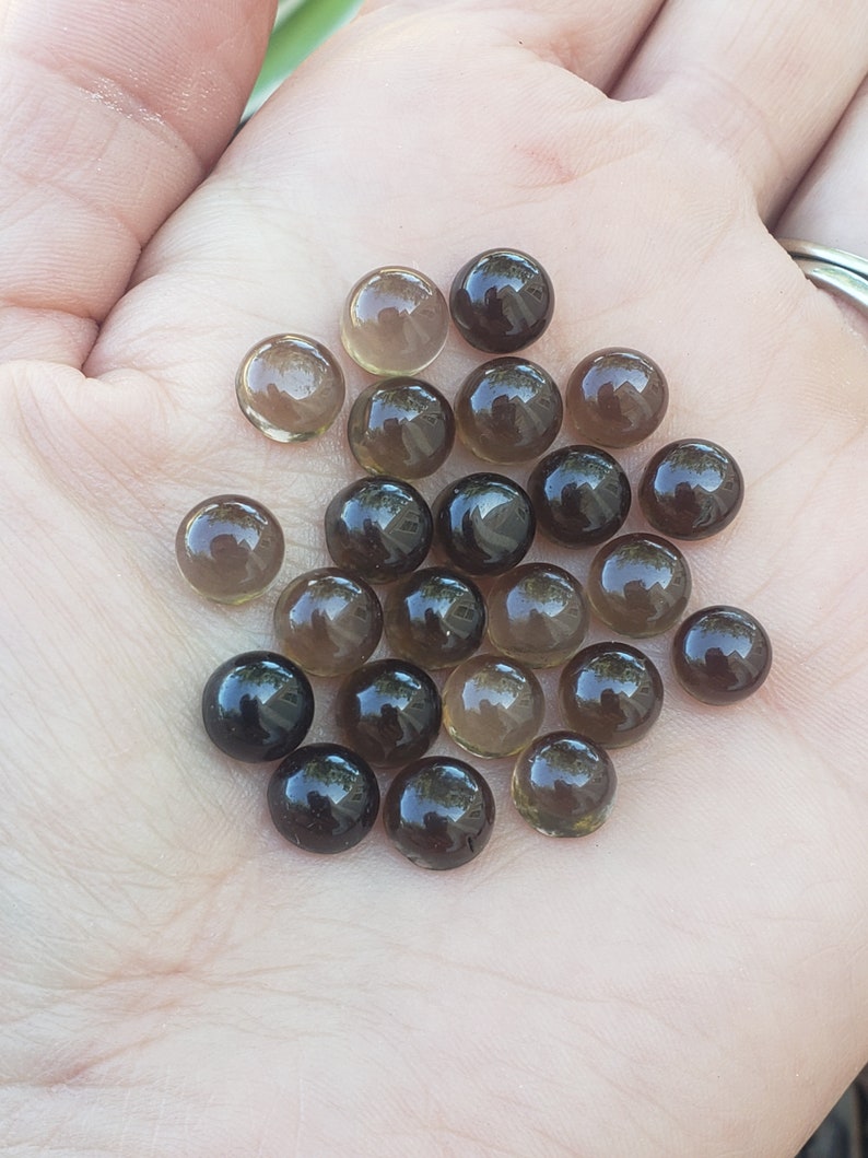 Smokey Quartz 7mm rounds. 1 piece Brown accents. Small Metaphysical. Jewlery making supplies. Gift ideas. random grab.