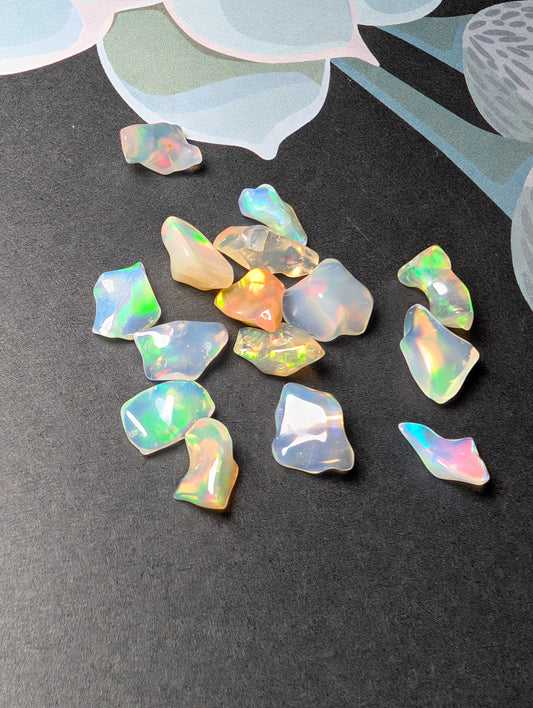 Lot of freeform Ethiopian Welo Opals. Tumbled chunks. 8 -16mm. 20 carats. Accents. Jewelry making supplies. Random grab lots.