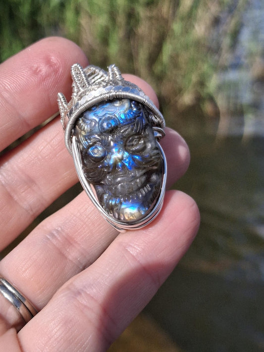 Stunning Wire wrapped pendant. Sterling silver Wire wrapped around a labradorite carved skull cabochon. Pendants. Heady. Gifts.