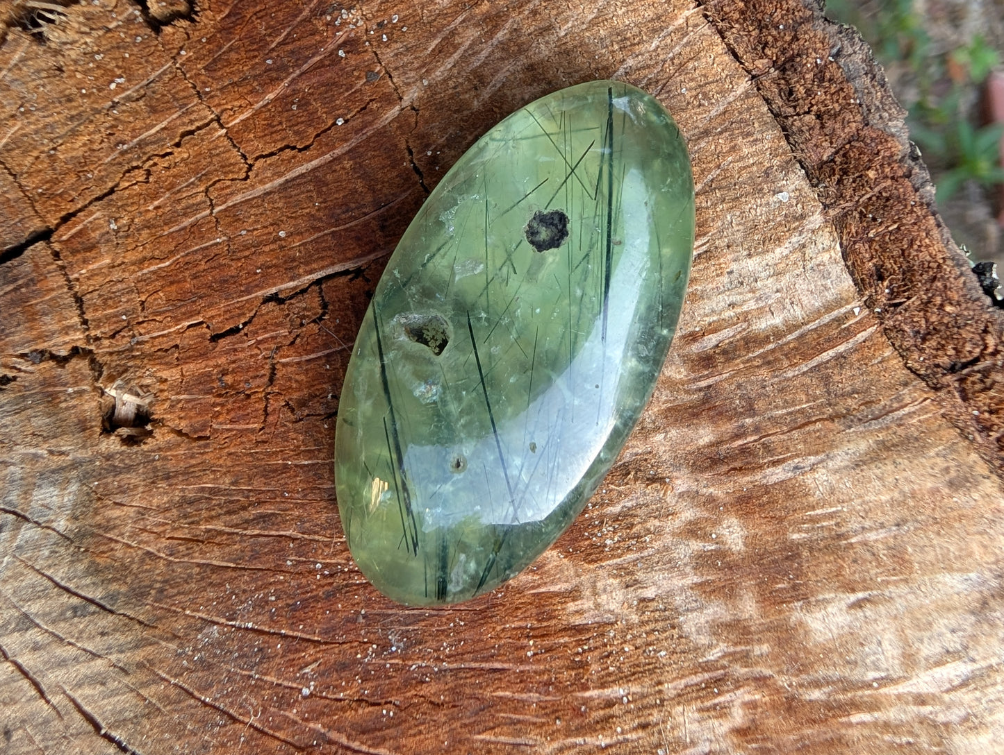 Phrenite cabochon with natural cavity. Oval . Green 42mm x 21mm