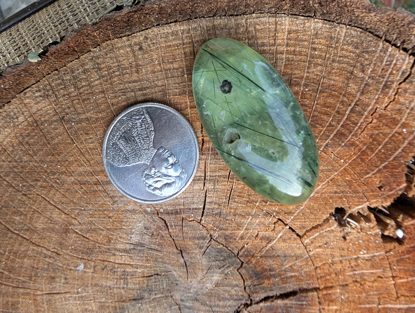 Phrenite cabochon with natural cavity. Oval . Green 42mm x 21mm